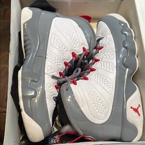 Gray and White Athletic Sneakers with Red Accents